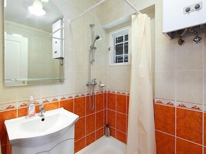 A bathroom with a sink, shower, and a window. - Francesco by Interhome (Balatonmariafurdo)