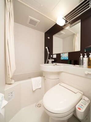 Combined shower/tub, free toiletries, hair dryer, slippers