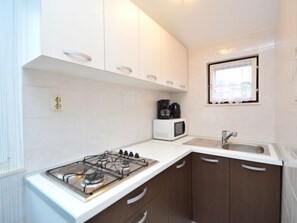 Fridge, microwave, cookware/dishes/utensils