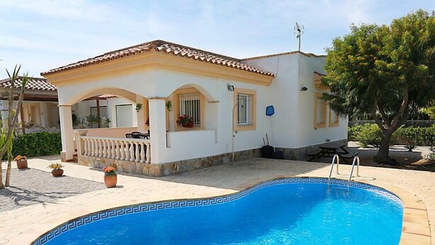 A house with a swimming pool, a covered patio, and a garden with potted plants. - Vacation home Vicky by Interhome (Deltebre)