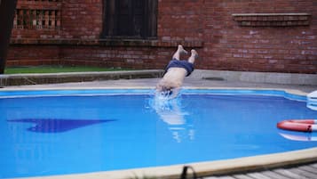 Outdoor pool, open 7:00 AM to 7:00 PM, pool loungers