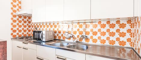 Fridge, microwave, cookware/dishes/utensils, dining tables