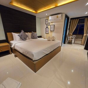 Standard Double Room | Minibar, in-room safe, desk, blackout drapes