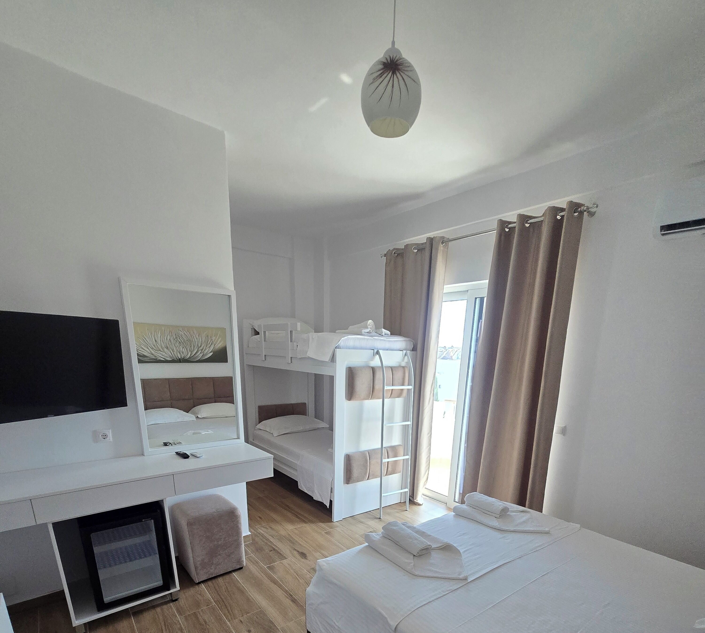 Comfort Quadruple Room | Premium bedding, desk, blackout drapes, soundproofing