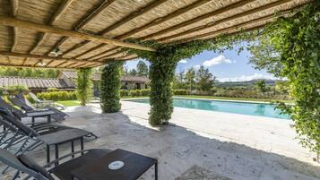 Seasonal outdoor pool, pool loungers