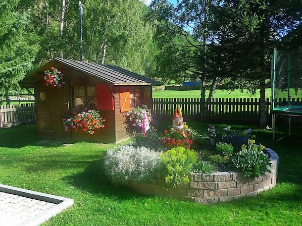 Situated in a serene garden, this charming gazebo offers a peaceful retreat.