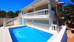 A two-story building with a swimming pool in front. - Vacation home Bilbao by Interhome (Roses)
