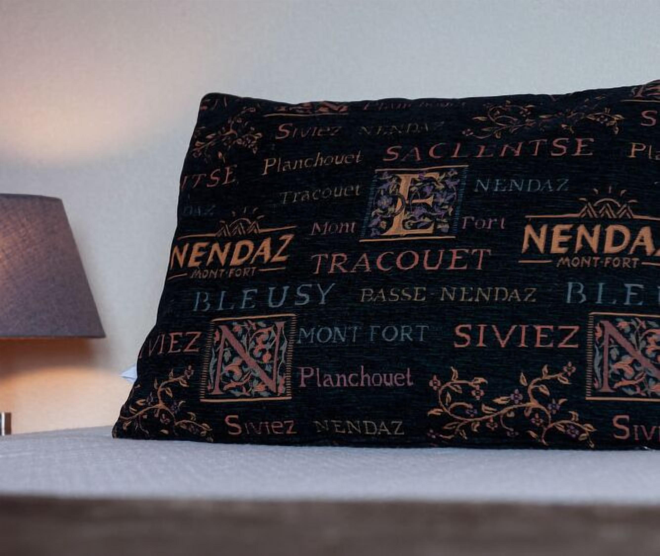 A pillow with embroidered text including "Nenda," "Montfort," and "Siviez."