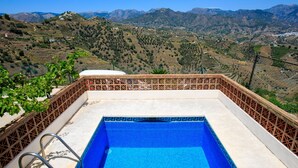 A swimming pool with a view of a mountainous landscape. - Villa Laura by Interhome (Nerja)