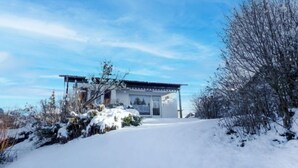 A modern house with a large garage and a covered porch. - Schöne Aussicht by Interhome (Dittishausen)