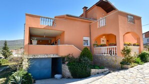 A two-story house with a balcony, a stone entrance, and a garden. - Apartment Karla by Interhome (Novigrad (Zadar))