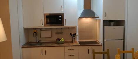 Fridge, microwave, stovetop, coffee/tea maker