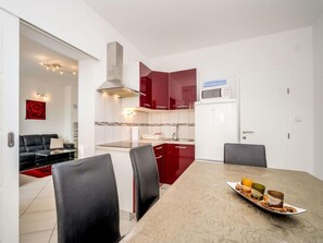 Fridge, cookware/dishes/utensils, dining tables