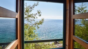 A window with a view of the sea and trees. - Villa Golubinka by Interhome (Hvar/Zastražišće)