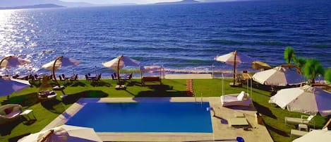 Seasonal outdoor pool, pool umbrellas, sun loungers