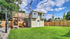 A two-story house with a fenced backyard and a wooden deck. - 7 Mi to Dtwn Denver: Arvada Home w/ Patio (Arvada)