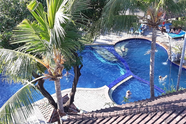 Outdoor pool, open 8:00 AM to 8:00 PM, pool loungers