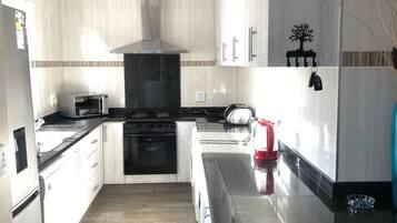 Superior Chalet (43 Montego Bay) | Private kitchen | Full-size fridge, microwave, oven, stovetop