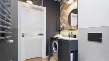 Shower, hair dryer, towels, shampoo