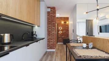 Fridge, stovetop, dishwasher, coffee/tea maker