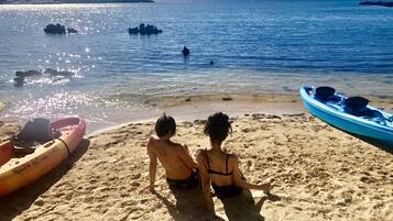 On the beach, sun-loungers, beach towels
