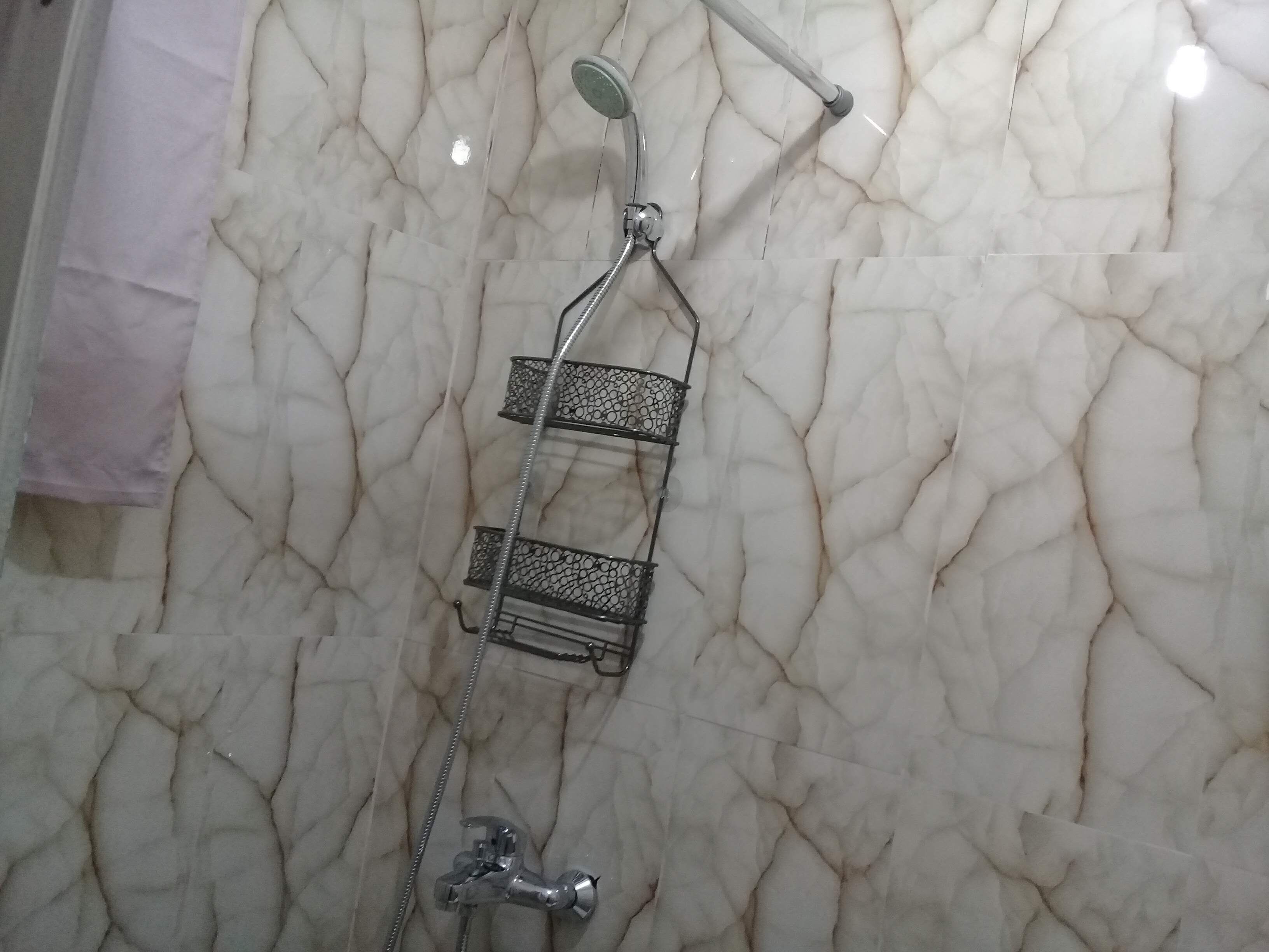 Shower, towels, soap, toilet paper