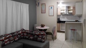 Premier Apartment | Living area | Flat-screen TV, DVD player - Aldeia dos Anjos (Gravatai)