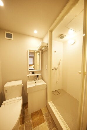 Shower, free toiletries, hair dryer, slippers