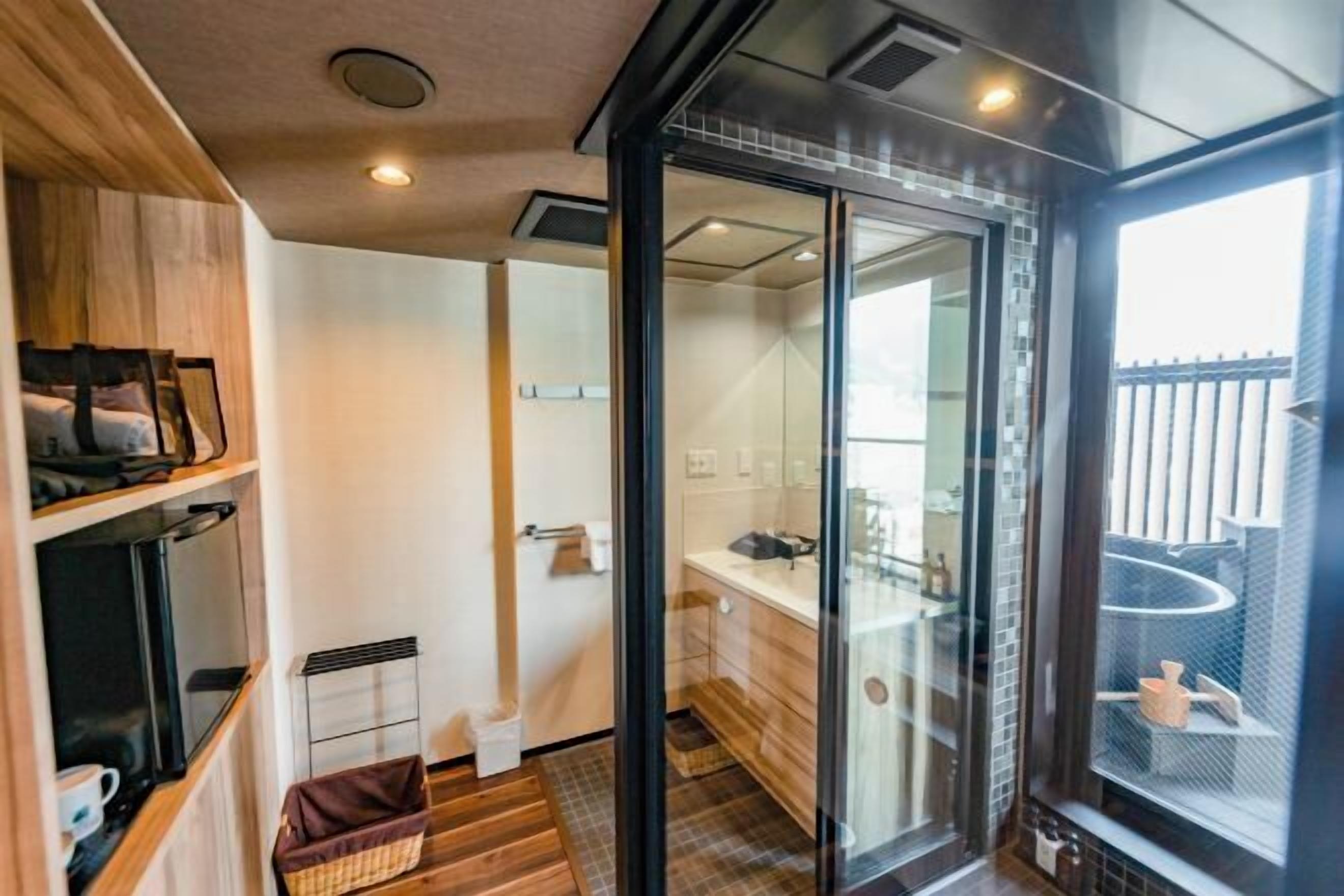 Separate tub and shower, free toiletries, hair dryer, slippers