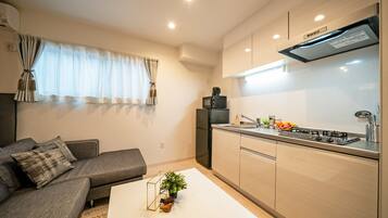 Apartamento, 1 quarto (#1,2) | Área de estar | TV de tela plana