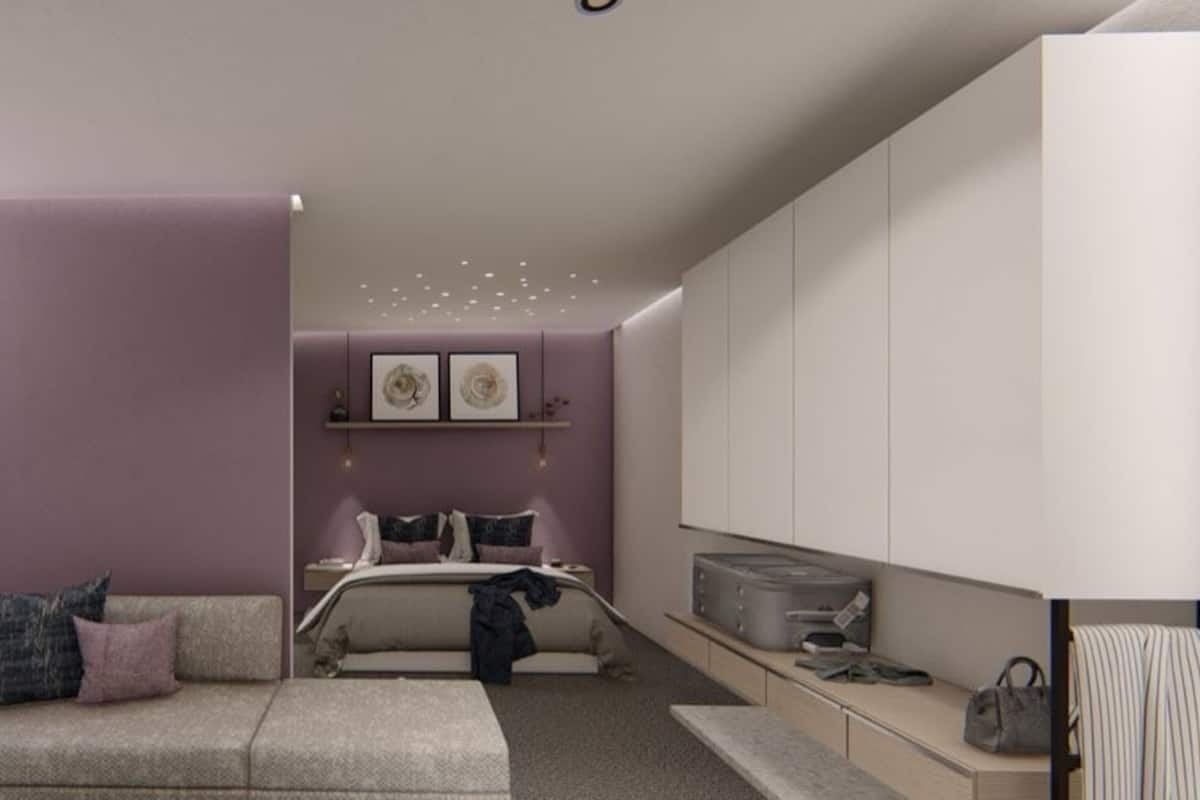 A modern bedroom with a bed, bedside tables, a nightstand, a dresser, and a potted plant.