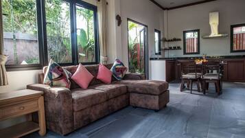 Executive Bungalow | Living area | 50-inch Smart TV with satellite channels, TV