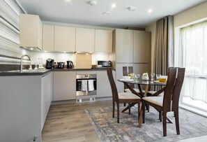 Apartment | Private kitchen | Full-sized fridge, microwave, oven, stovetop - Fortified Luxury Apartment (Chatham)