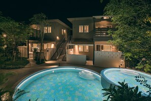 A modern two-story house with a swimming pool and a staircase leading to the upper floor. - Mihana Onna-Son (Onna)