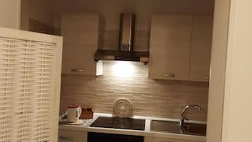 Studio, Patio | Free minibar items, blackout drapes, iron/ironing board