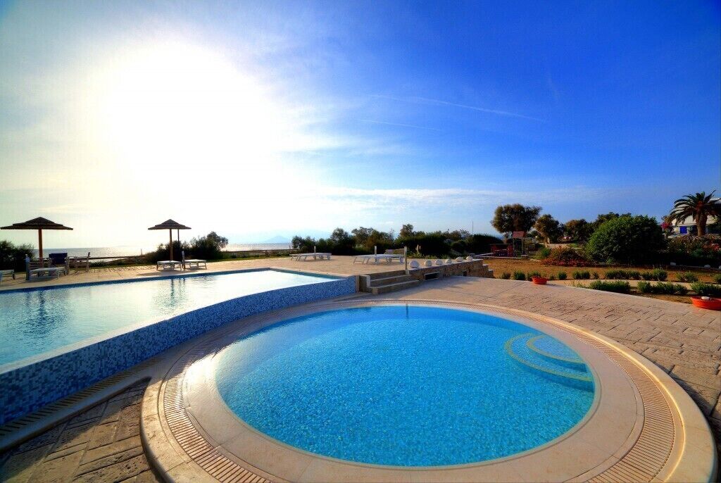 outdoor pool, pool umbrellas, pool loungers