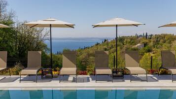 Outdoor pool, pool umbrellas, sun loungers