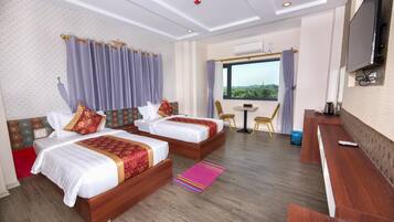 Habitación Deluxe con 1 cama doble o 2 individuales | Minibar, caja fuerte, escritorio y cortinas opacas