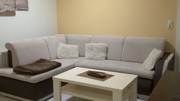 Apartemen Klasik (Strandidyll 3) | Area keluarga | TV layar datar