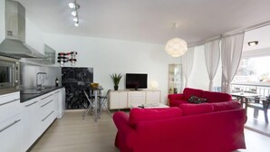 A modern apartment with a kitchen, dining area, and living room. - Europa I by Interhome (Calpe/Calp)