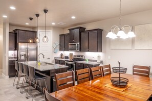 Dining Table View - With an open and spacious floor plan, the Dining Room and Kitchen can accommodate meal preparations for groups large or small.