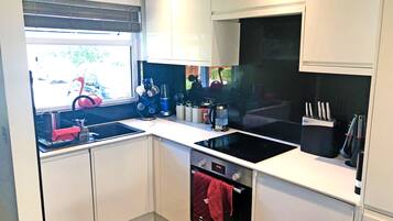 Dishwasher, coffee/tea maker, cookware/dishes/utensils