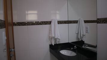 Shower, rainfall showerhead, hair dryer, towels