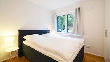 1 bedroom, premium bedding, down comforters, individually decorated