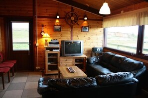Cottage, 4 Bedrooms | Living area | Flat-screen TV, DVD player - Snorrastadir Farm Holidays (Borgarnes)