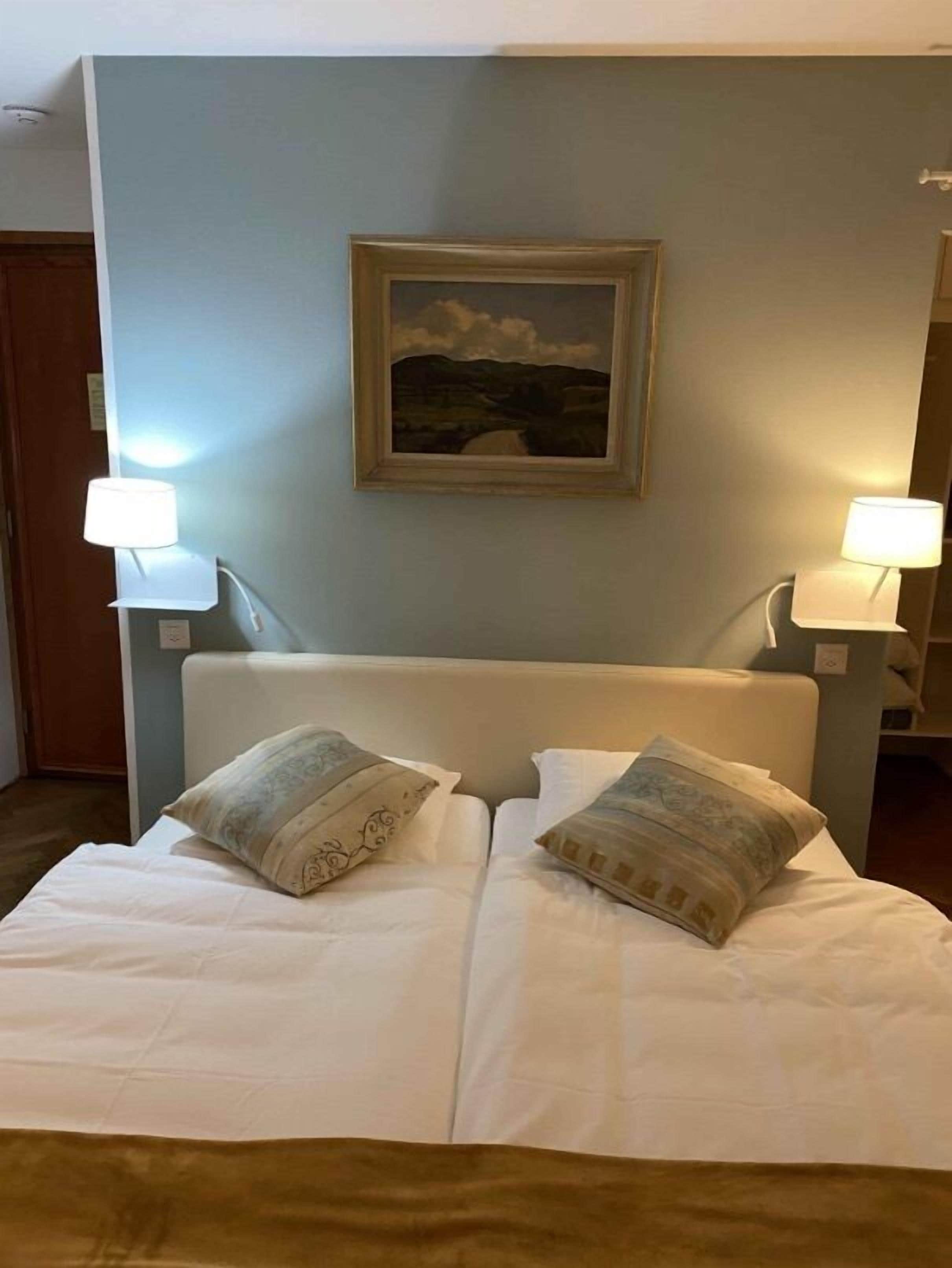 double room, lake view | in-room safe, individually decorated, individually furnished