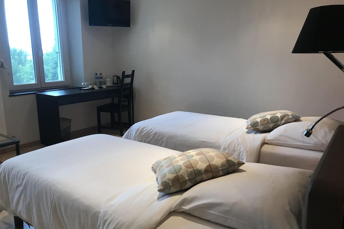 superior twin room, lake view | in-room safe, individually decorated, individually furnished