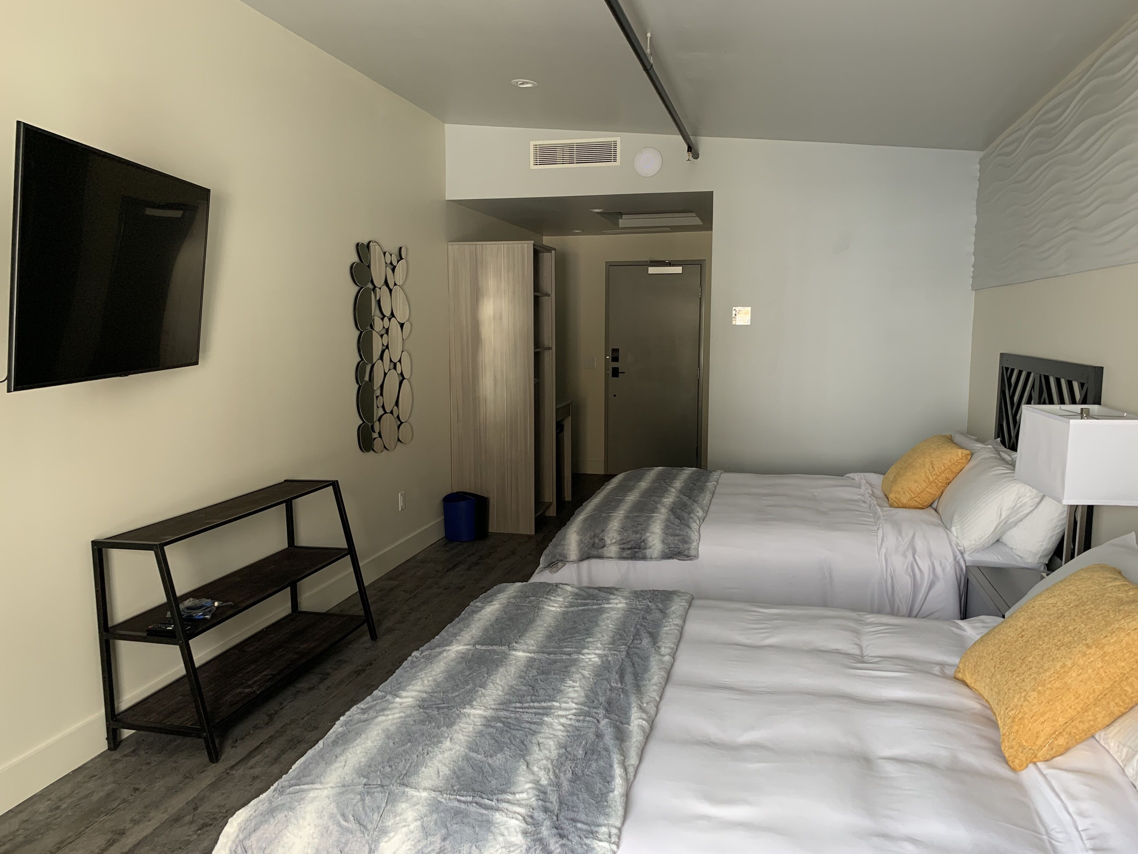 economy quadruple room | living area | 55-inch flat-screen tv with cable channels, tv, netflix