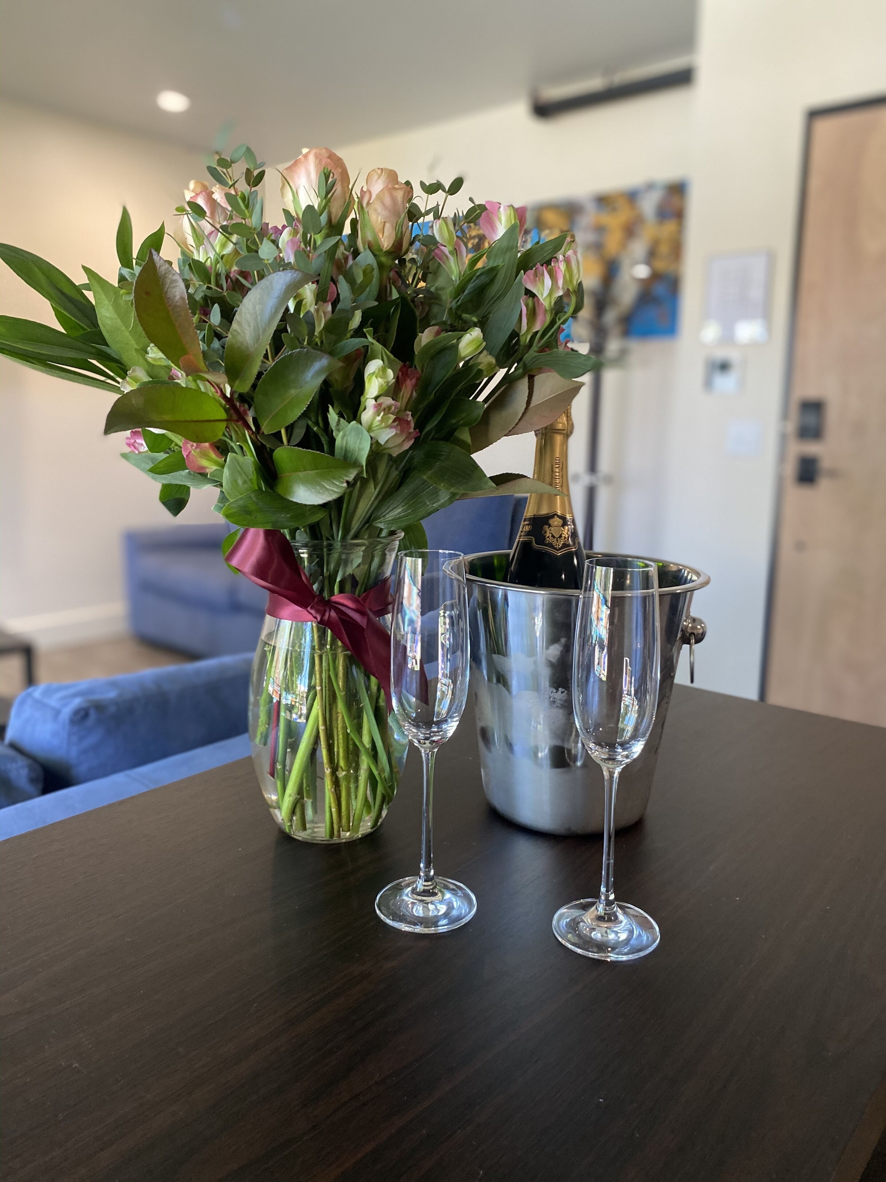 deluxe quadruple room | living area | 55-inch flat-screen tv with cable channels, tv, netflix