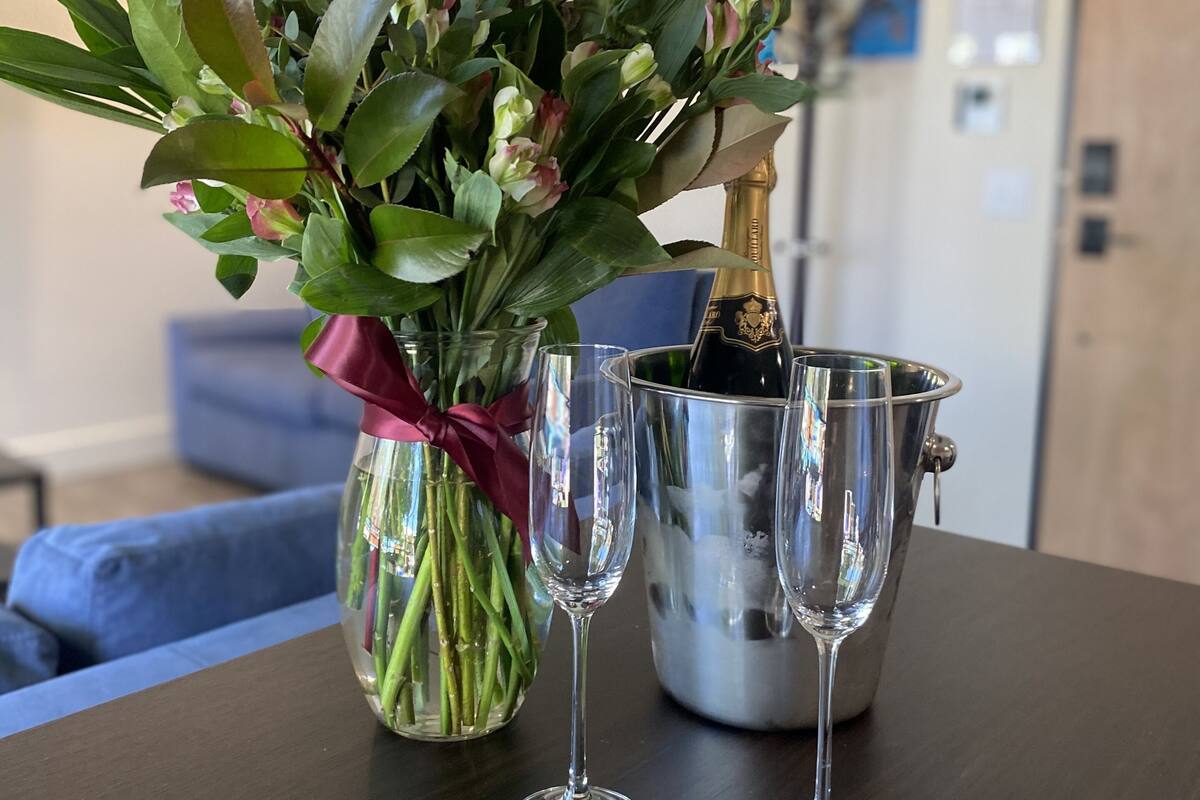 deluxe quadruple room | living area | 55-inch flat-screen tv with cable channels, tv, netflix